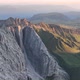 Dolomites mountains peaks with a hiking path on a summer sunrise - VideoHive Item for Sale