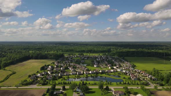 Timelapse of residential area on countryside in farm fields, south East Michigan, USA, Aerial view