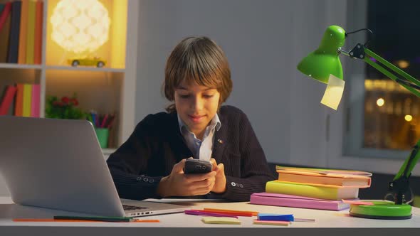 Portrait of Caucasian School Boy Using Social Network