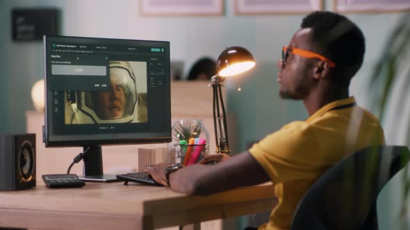 Black Man Retouching Photo on Computer