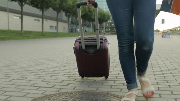 Businesswoman Tourist Walking with Luggage. Walk Down the Street with Suitcase Bag Luggage, Tickets