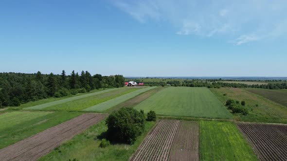 Aerial drone view of a flying over the rural agricultural landscape.