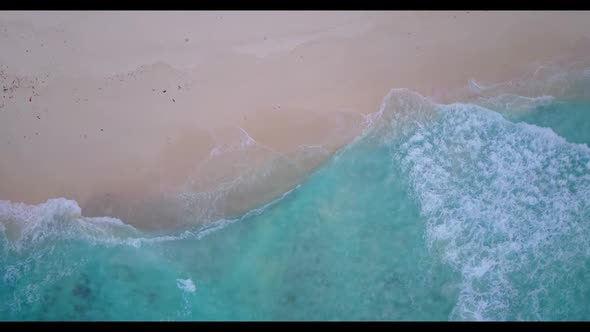 Aerial view seascape of luxury seashore beach voyage by shallow lagoon with white sand background of