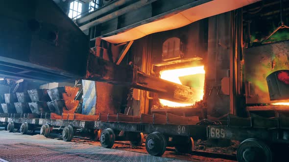 Industrial Machine is Loading Copper Materials Into a Furnace