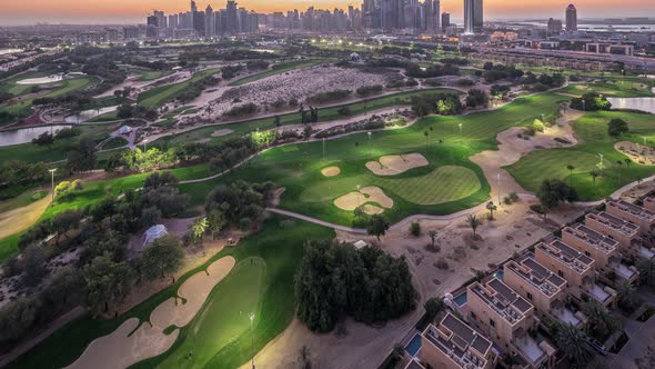 Dubai Marina Skyscrapers and Golf Course Day to Night Timelapse Dubai United Arab Emirates