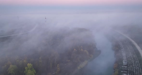 Early Morning Mist Floating Over Calm Water Lake