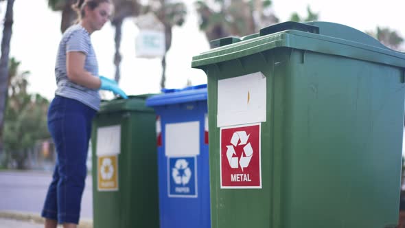 Volunteer Checking Garbage in Waste Bins for Separate Trash Collection on Mediterranean Resort