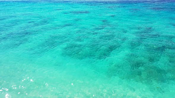 Beautiful aerial copy space shot of a summer white paradise sand beach and blue ocean background in 