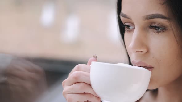 Pretty Young Lady Robe Drinks Coffee Dreams Near Window