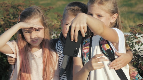 Cute Pupils Taking a Selfie Outdoors