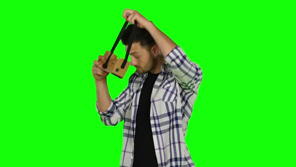 Virtual Reality Game. Boy Uses Head Mounted Display. Green Screen