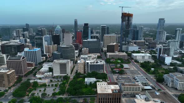 Truck shot of Austin, Texas skyline. Skyscrapers and cloudy sky in metropolitan setting. Urban, majo