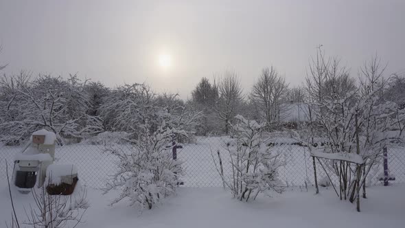 Mystical Sunset Through Thick Clouds in the Sky and Winter Nature Around