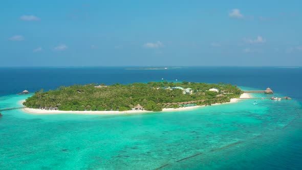 Aerial View of a Tropical Island and Corral Reef in the Indian Ocean