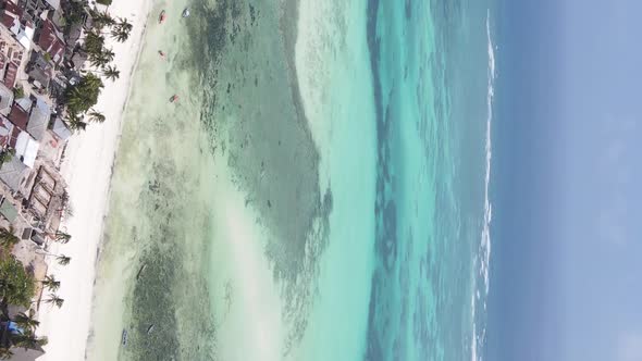 Vertical Video of the Ocean Near the Coast of Zanzibar Tanzania Aerial View