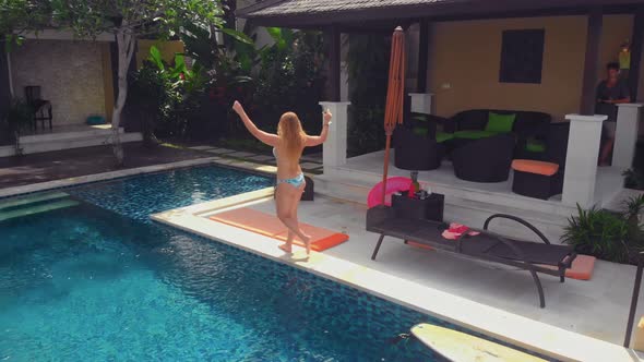 Flight Overlooking the Villa and Girls Near Uluwatu Town on Bali Island Indonesia