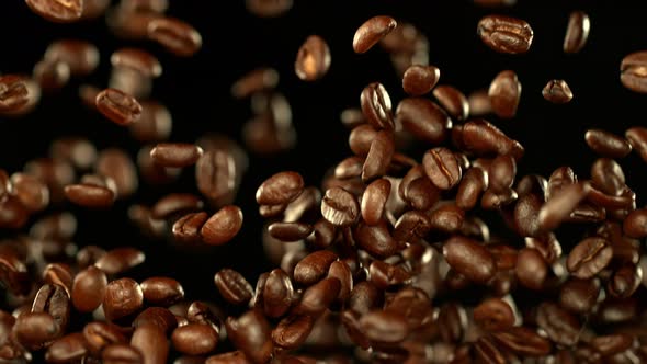 Super Slow Motion Shot of Exploding Premium Coffee Beans Towards the Camera at 1000Fps