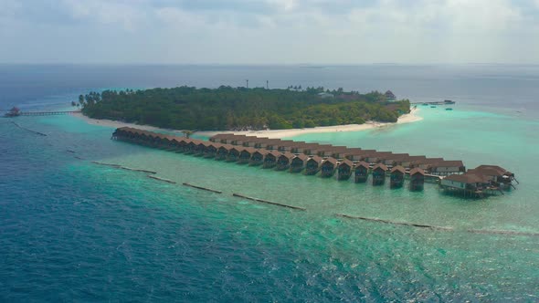 Aerial View of Luxury Water Villas Resort on Maldives Island