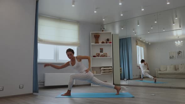 Young Woman Practicing Yoga in Studio