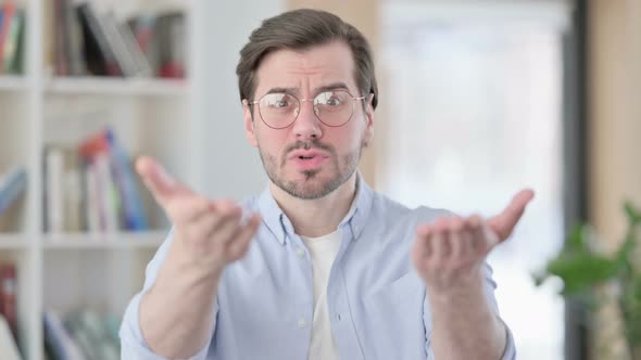 Portrait of Angry Man in Glasses Arguing Fighting