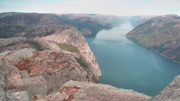 A cinematic view of cliff Preikestolen in fjord Lysefjord - Norway - nature and travel background ti