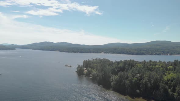 Aerial drone view over forest lake in the summer