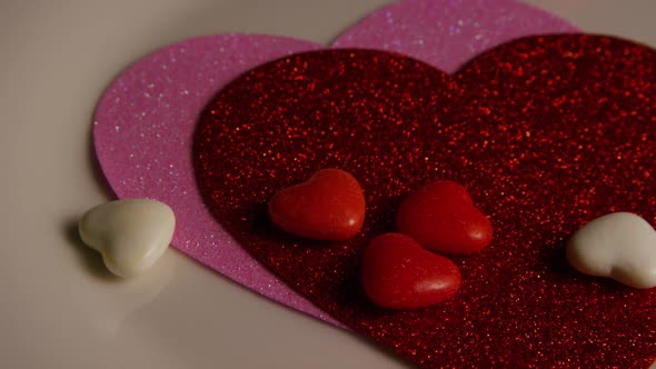 Rotating stock footage shot of Valentines decorations and candies - VALENTINES 0099