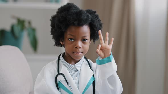 Closeup African American Little Girl Standing in Medical Clothes Playing Pretending to Be Doctor