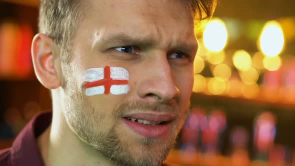 English Sports Fan Extremely Happy About Favorite Team Victory, Flag on Cheek