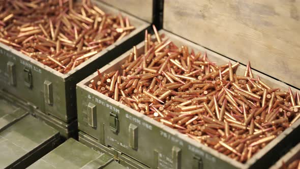 Huge stack of military boxes filled with rifle ammunition. Endless animation. 4K