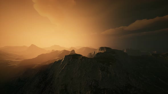 High Mountain Peaks Covered with Dramatic Heavy Fog