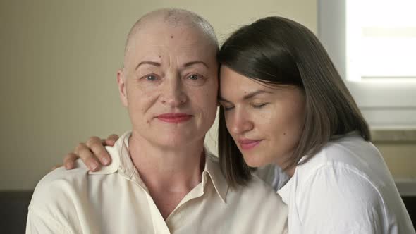 Young Woman Hugs Her Sick Mom After Chemotherapy