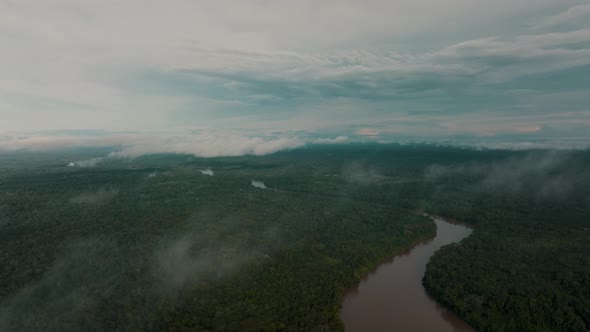 Slow aerial flyover Amazon River and green Jungle Landscape of Peru during cloudy day,South America