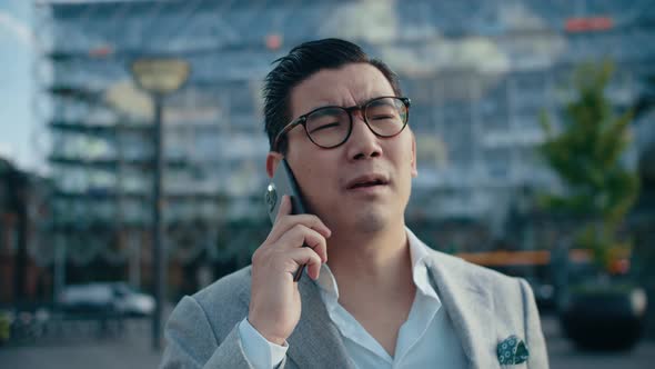 Korean Businessman On Call In City