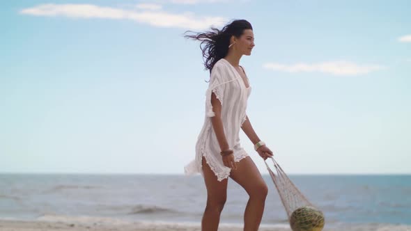 Romantic Woman with Watermelon on the Beach Outdoors