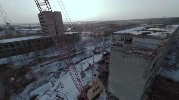 FPV Drone Flies Quickly and Maneuverable Among Abandoned Industrial Buildings and Around an