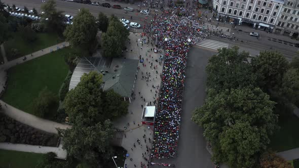 Aerial View on Crowd of People Who are Running a Marathon in Riga