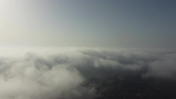 High Above the Thick Fog Like Beautiful Ocean of Clouds at Sunrise