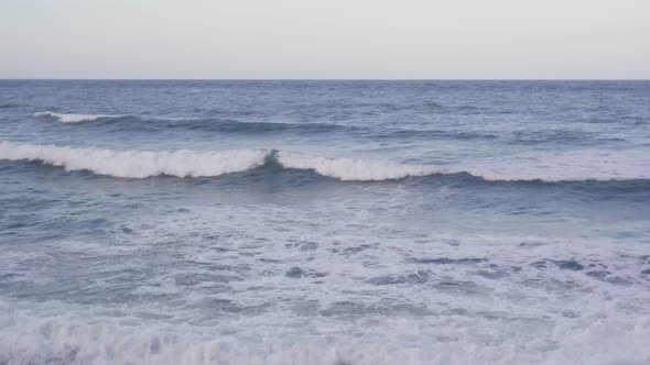 Wide Shot Seascape of Blue Azure Foamy Mediterranean Sea Waves Rolling on Summer Day Outdoors