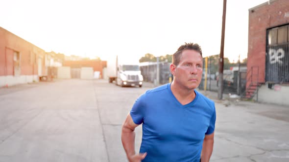 Middle-aged man jogging to get back into shape