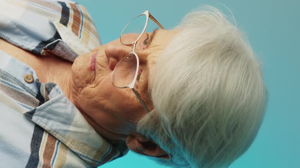 Senior Caucasian Woman Worrying About Personal Health Problems in Hospital Vertical Video Blue