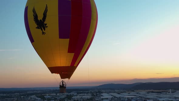 Close up shot of a hot air balloon at sunset using fire to stay afloat.