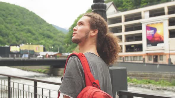 Traveler with Red Backpack Walking on Mountain. Travel Lifestyle Adventure Vacations Freedom Concept