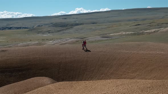 Woman with Child Girl Hiking in Altai Steppe