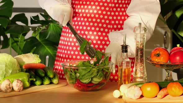 Making vegetable salad with Tomatoes, Cucumbers, Scallion and Olive Oil