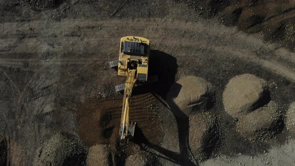 The work of the excavator. Digger from the air.