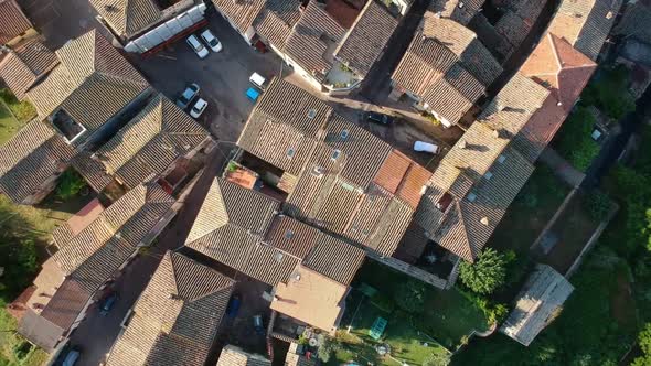 Small village in ccountryside, spinning aerial footage, drone going upward