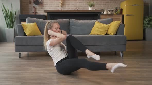 Woman Doing Exercises at Home