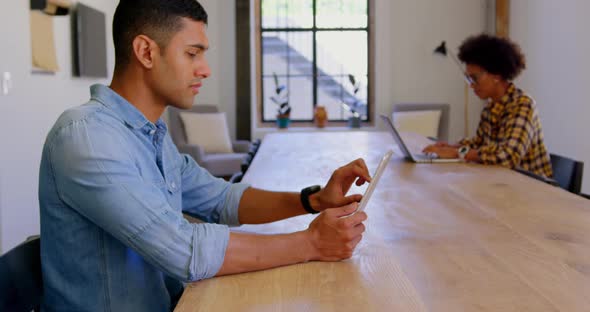 Caucasian Businessman using digital tablet in a modern office 4k