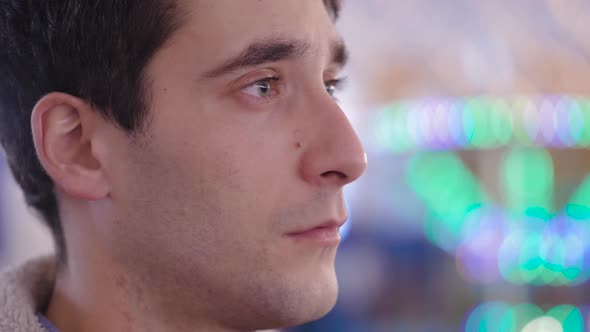 portrait of serious pensive young man at christmas time